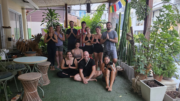 Group yoga namaste at GREENLIGHT Resort
